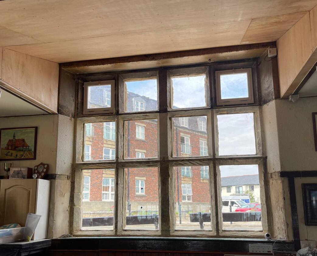 Newly renovated west window from inside the building Newly renovated west window from inside the building