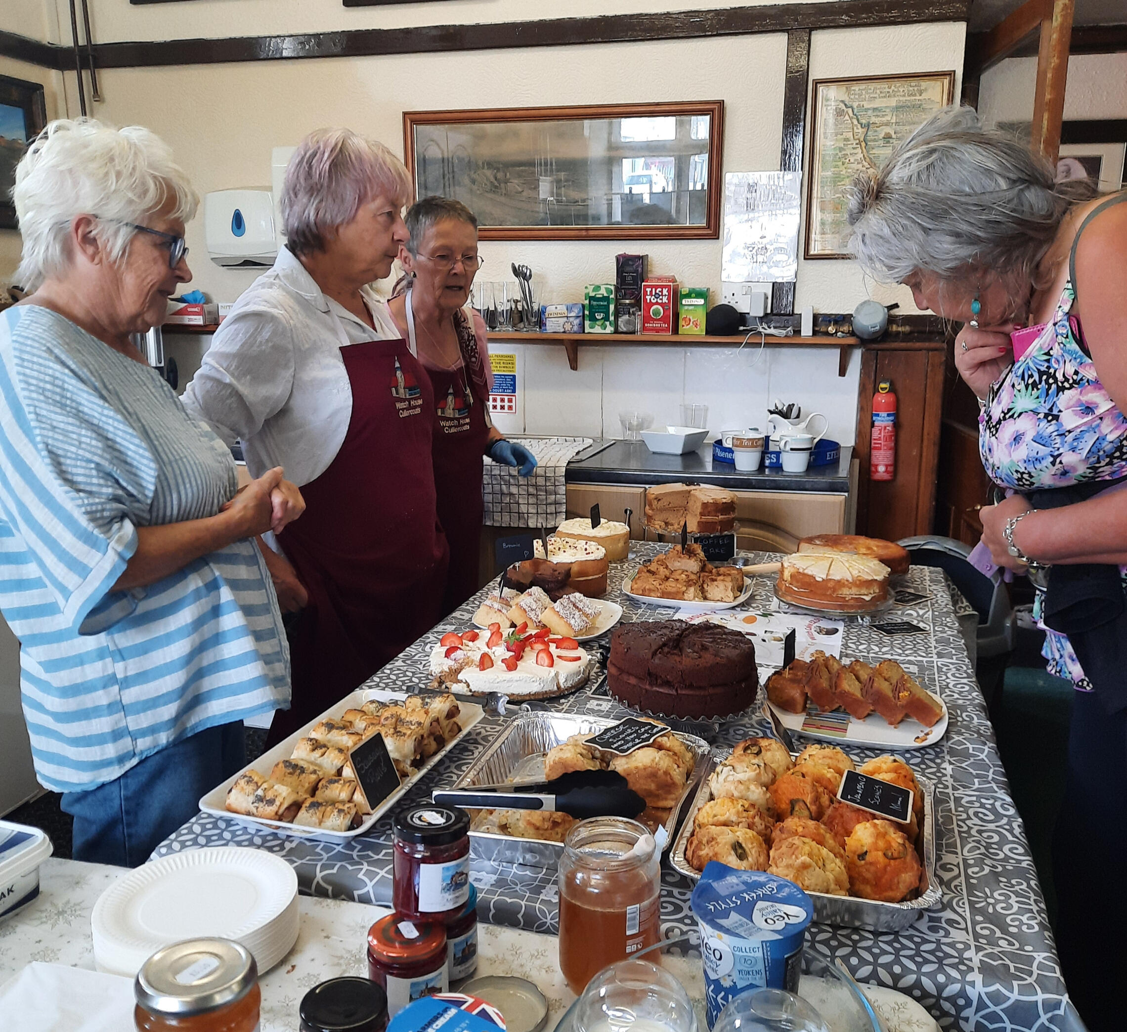 Volunteers at the Watch House ready to serve a mouthwatering selection of cakes and savouries.